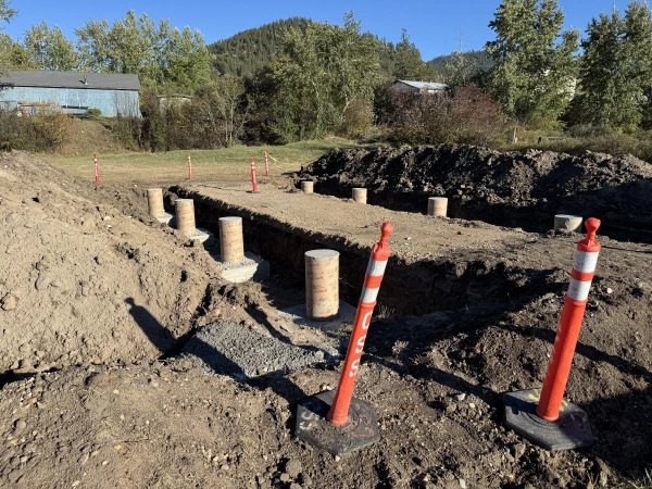 The poured piers, backfilled and ready to overwinter before the pad went in this spring.